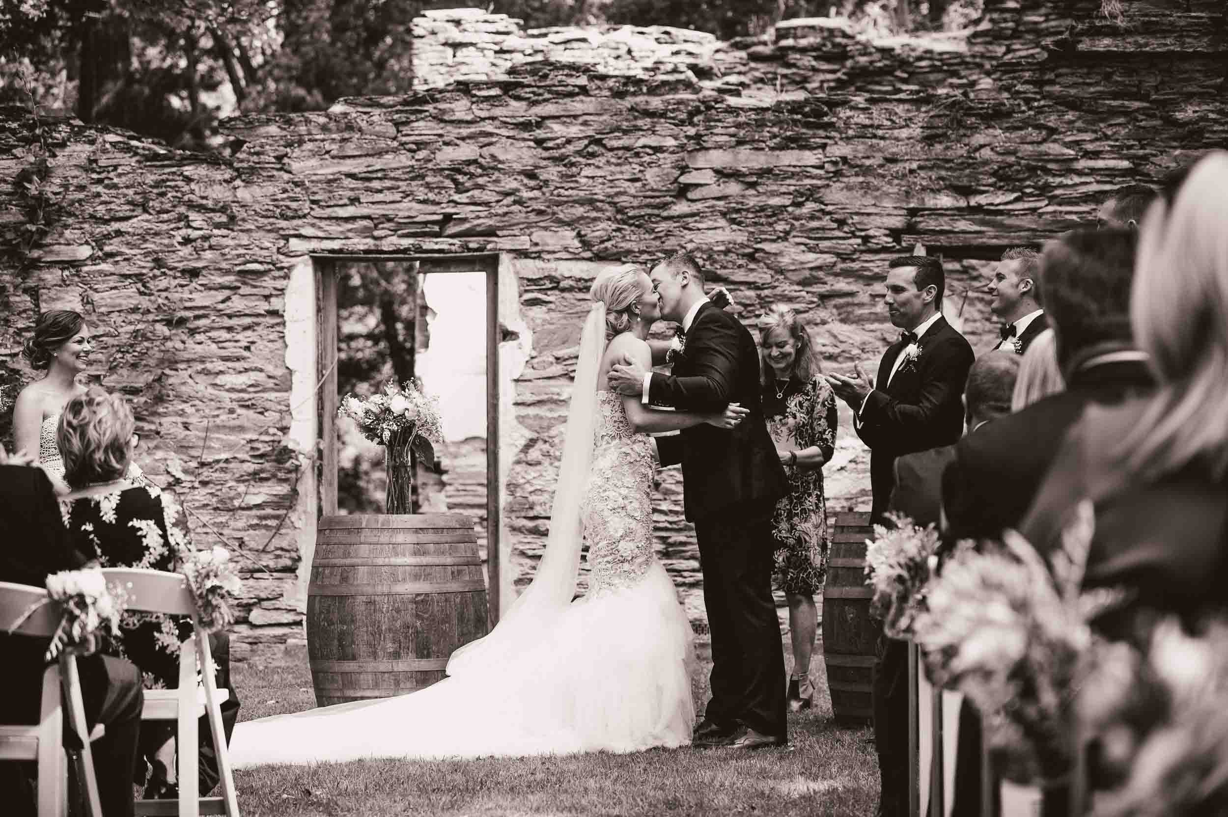 Thurlby Domain ruins wedding ceremony bride groom first kiss