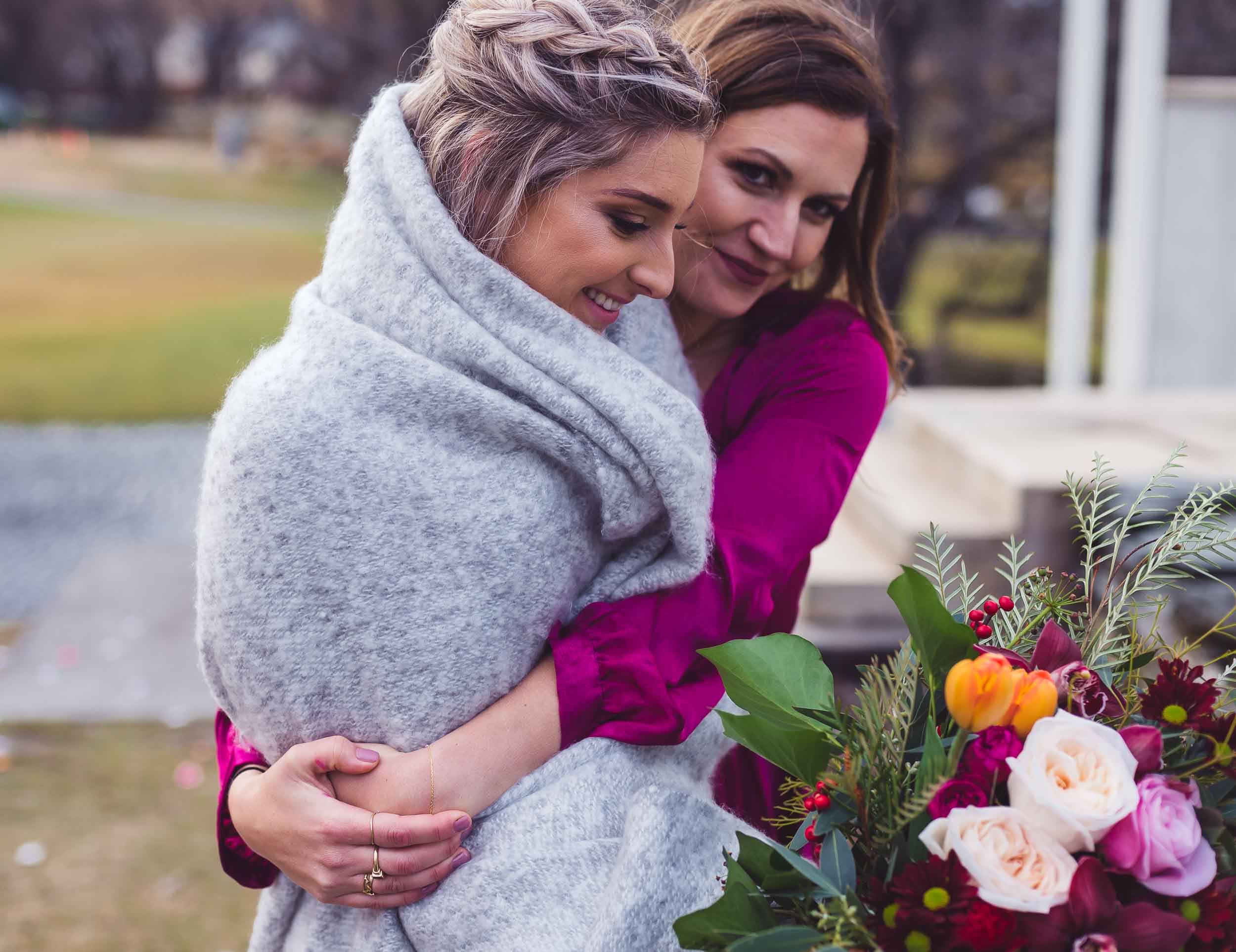 Millbrook resort winter wedding secret garden ceremony bouquet hug