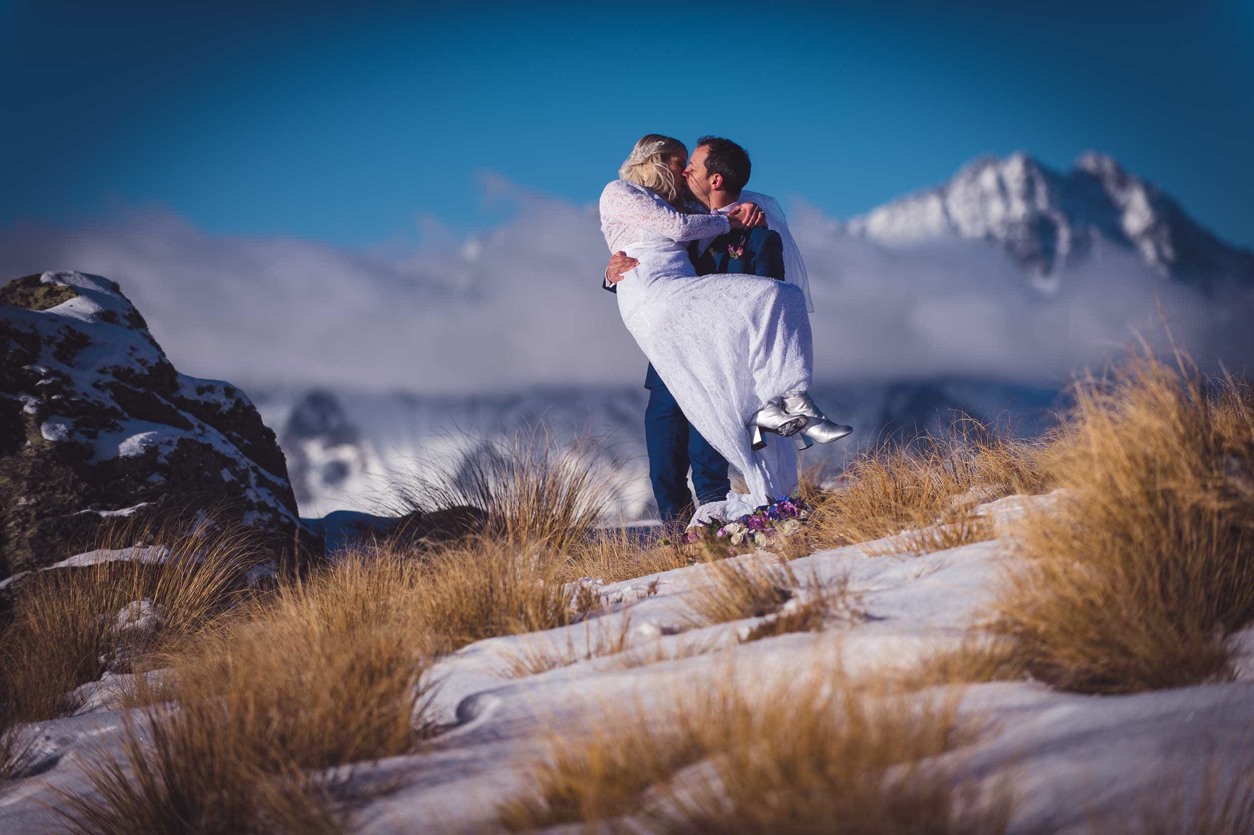 Queenstown destination elopement Cecil Peak snowy helicopter bride groom