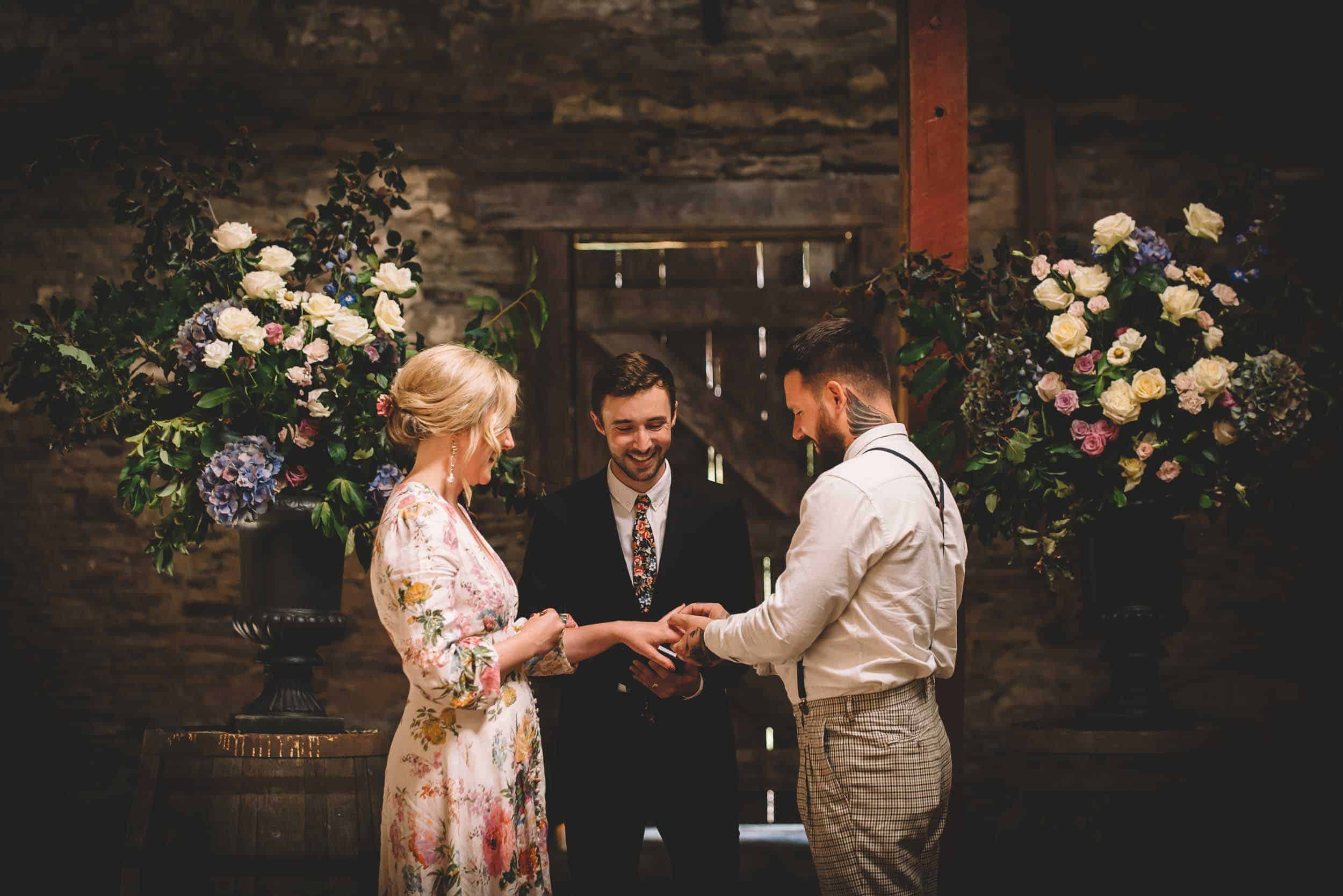 Nick & Nina's Thurlby Domain Elopement old stone stables wedding ceremony exchanging rings