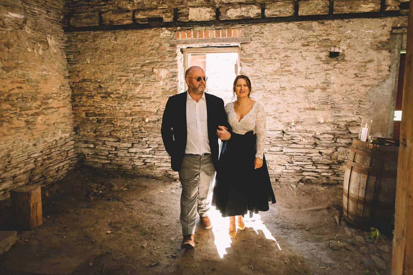 Sam & Kirk's Thurlby Domain Elopement - bride walking down the aisle old stone stables