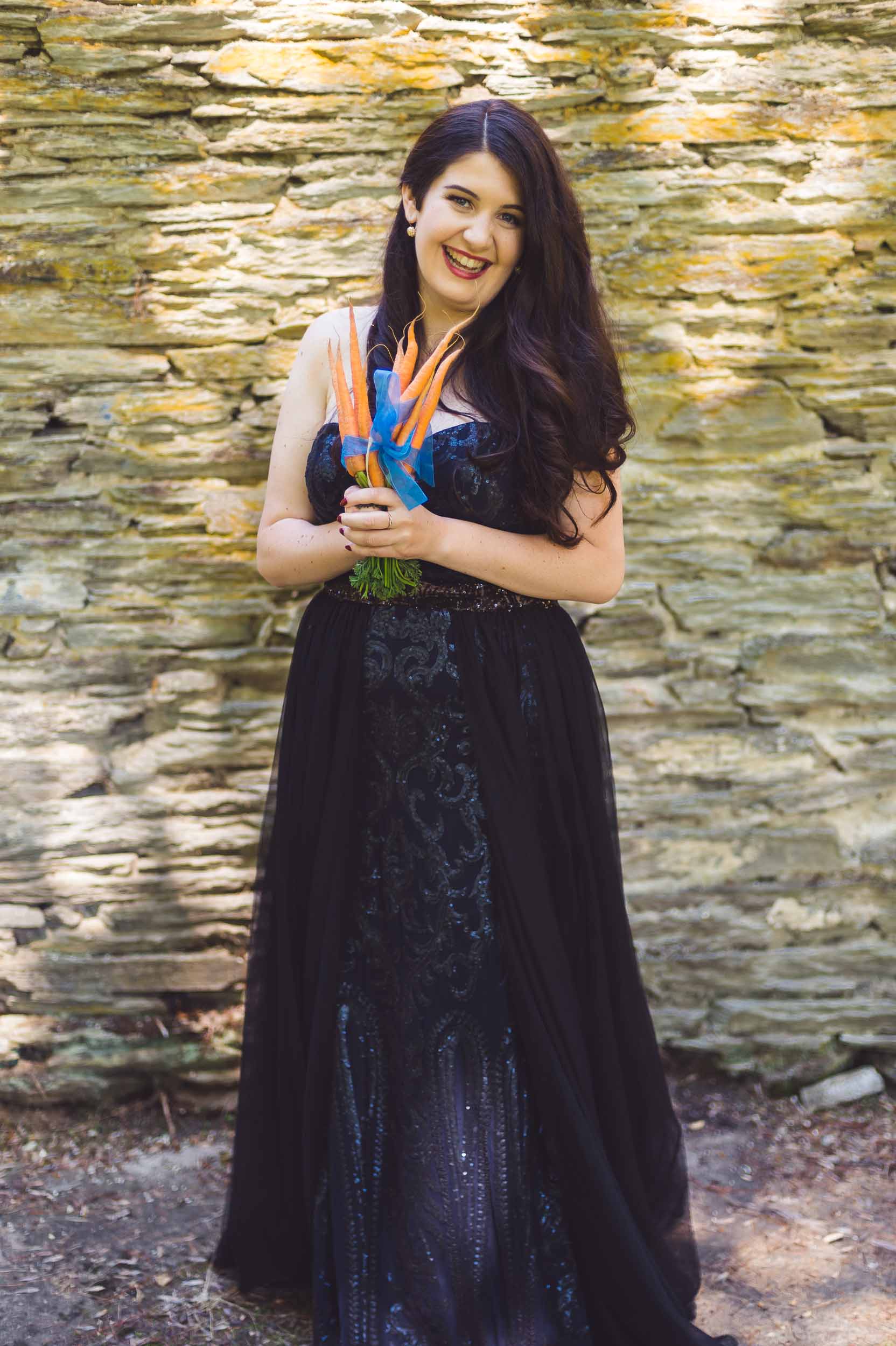 thurlby domain wedding ceremony bride with carrot bouquet